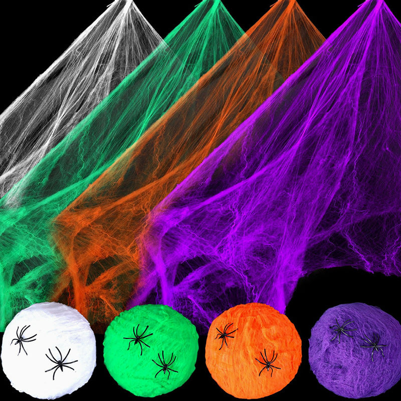Green Halloween spiderweb decor stretched across a display