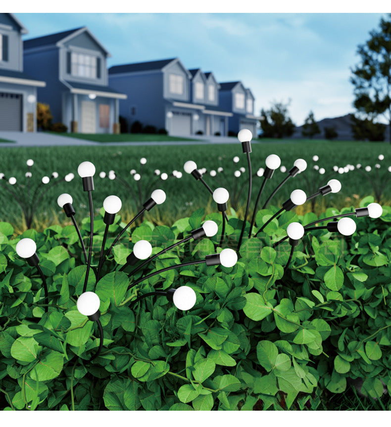 Solar firefly garden lights arranged in a front yard